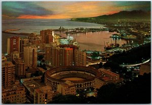 VINTAGE CONTINENTAL SIZE POSTCARD THE BULLRING AND HARBOR AT MALAGA SPAIN B