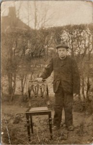 RPPC Man News Boy Cap in Garden with Chair Real Photo c1907 Postcard U16