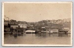 St Johns Newfoundland RPPC From Harbor Homes People Boat Piers Dock Postcard N25