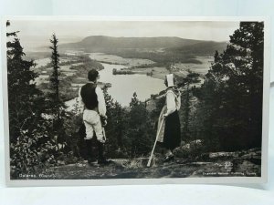 Couple on Hillside Admiring View At Dalarna Sweden Vintage Postcard Posted 1946