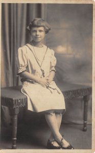 1920s RPPC Real Photo Postcard Well Dressed Young Girl On Bench