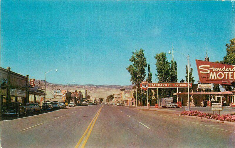 Autos Standard Gas pumps Motel Main Street 1950s Richfield Utah Postcard 4356
