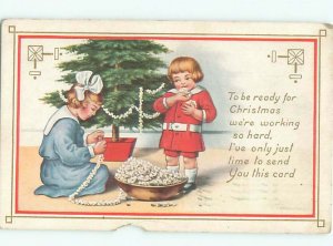 Pre-Linen Christmas KIDS MAKE POPCORN STRINGS FOR THE CHRISTMAS TREE AB5311