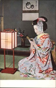 Beautiful Japanese Woman with Compact Mirror Geisha Vintage Postcard