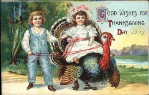 Thanksgiving Boy and Girl Riding Giant Turkey c1910 Vintage Postcard
