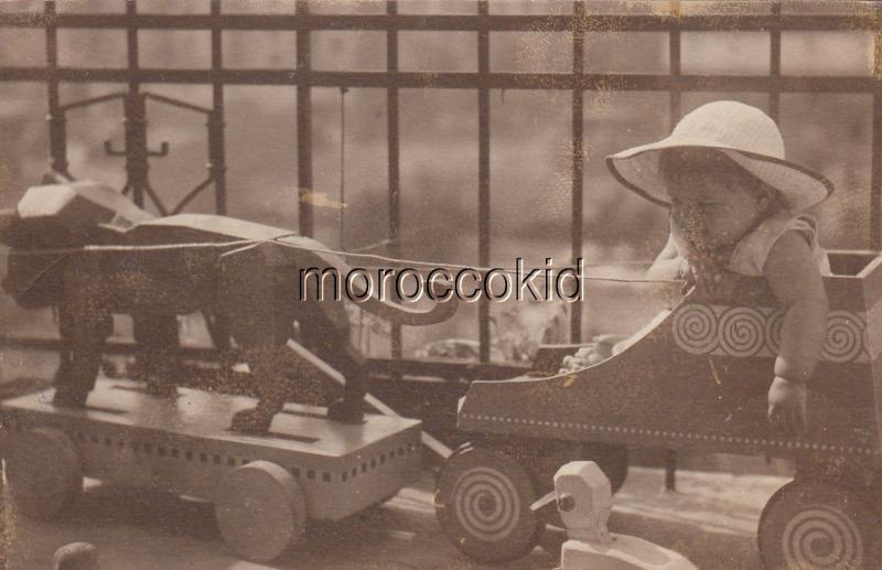 1908 USED GERMANY POSTCARD CHILD IN WOODEN SHOE, PULLED BY WOODEN LION w WHEELS