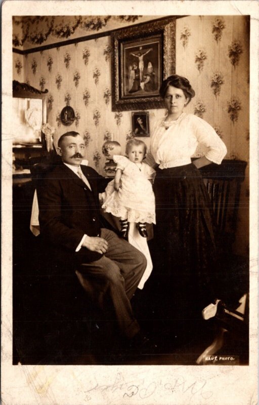 Real Photo Postcard Family, Man, Woman and Small Baby Inside Their House