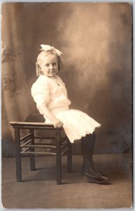Pretty Little Girl White Dress Hair Ribbon Sitting Real Photo RPPC Postcard