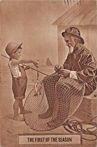 THE FIRST OF THE SEASON-YOUNG BOY SHOWS CATCH TO OLD FISHERMAN POSTCARD 1910