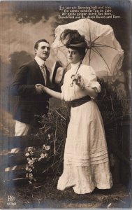 Romantic Couple With An Umbrella Vintage RPPC 03.61