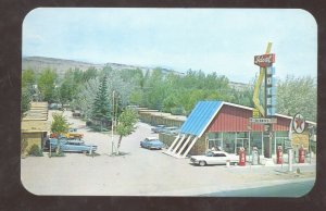 RAWLINS WYOMING EDEAL MOTEL GAS STATION OLD CARS ADVERTISING POSTCARD