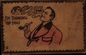 Man Smoking Pipe Woman's Face Appears ON REAL LEATHER c1905 Postcard