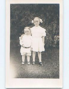 Pre-1918 rppc CUTE GIRL WITH BOWS IN HAIR WITH LITTLE BROTHER HM0210