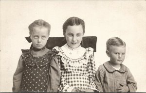 RPPC Children Calico Dress Those Eyes Cute Boy c1910 Postcard U8