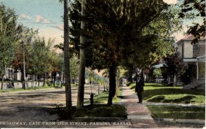 Parsons, Kansas - Man walking the sidewalk on Broadway, East from 15th - c1908