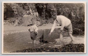 RPPC Young Boy With Toy Boat In Water Real Photo Postcard A48