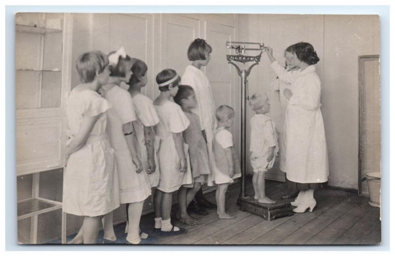 Postcard Children waiting to Weigh on Scale photo D14