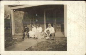 Family on Porch Garden Hose Kansas City MO Cancel c1910 Real Photo Postcard