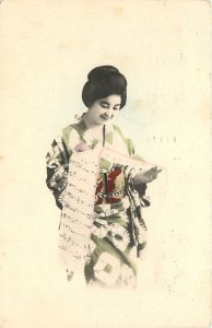 c1910 Hand-Colored Postcard; Smiling Japanese Woman Reads from a Scroll, Posted