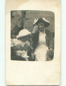 circa 1910 rppc DOG IN CORNER & BABY WITH TOY SHOVEL o2537