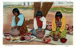 Pueblo Indian Women making Pottery