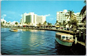 VINTAGE POSTCARD THE NEW ALGIERS HOTEL AND SIGHT-SEEING BOATS AT MIAMI FLORIDA