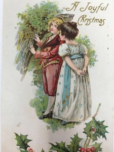 A Joyful Christmas Boy Girl Couple in Love Carving Initials in Tree Postcard