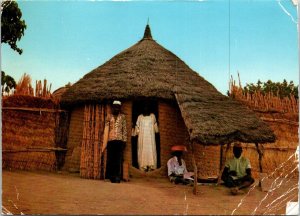 VINTAGE CONTINENTAL SIZE POSTCARD VILLAGE HOUSE NORTHERN NIGERIA [creasing] 1978