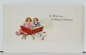 Christmas Wish 1920s Children with Book Embossed Postcard L15