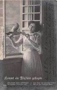 WOMAN HOLDING PIGEON WITH NOTE~GREETING PHOTO POSTCARD 1912