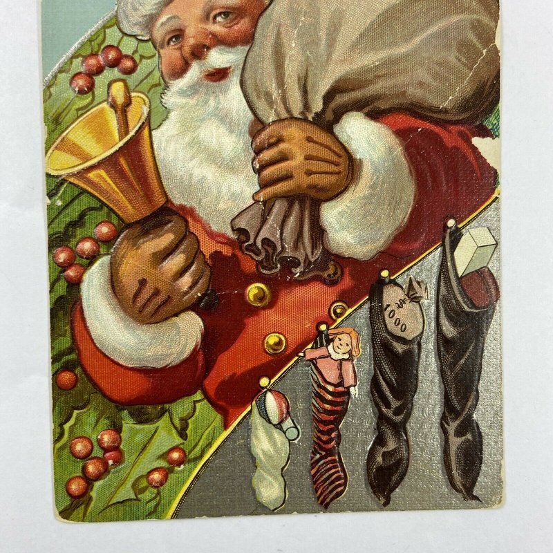 c.1915 Old Santa Claus Bell Toys Sack Bag Stockings Embossed Christmas Postcard