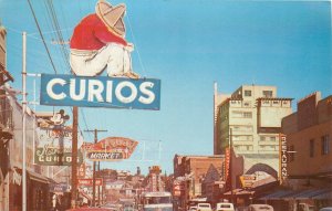 1950s Nogales Arizona Main Shopping Street bus autos Roberts Postcard 25-12249