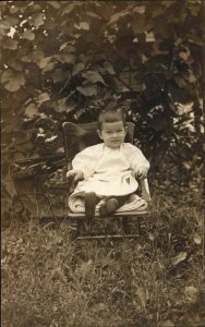 Cute Baby Kitchen Chair Outside Jersey Shore PA Cancel c1910 Real Photo Postcard