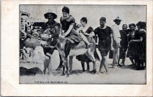 Postcard NJ - Woman on a donkey on the beach in Atlantic City