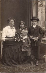 Real Photo Postcard Mother and Three Children in Photo Studio