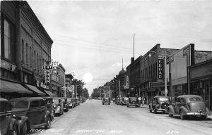 Manistique MI Street View Storefronts Cedar Theatre Old Cars RPPC Postcard