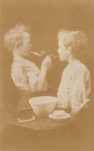 RPPC CHILDREN TOBACCO SMOKING PIPES REAL PHOTO POSTCARD (c. 1910)