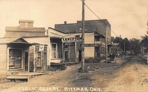 Rittman OH Public Square Dirt street Storefronts Horse & Wagons RPPC Postcard