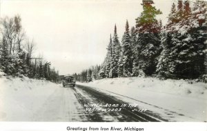 postcard RPPC Michigan Iron River Winter road North woods autos 23-4923