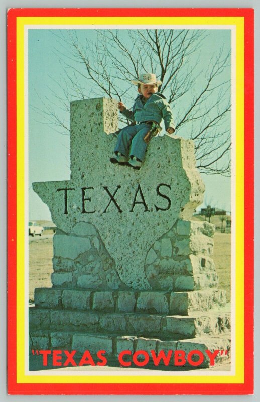 Texas GreetingsYoung Cowboy Sits Atop State MarkerStandard Chrome