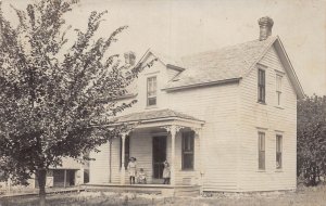 J74/ West Point Nebraska RPPC Postcard c1910 Farm House Kids 399