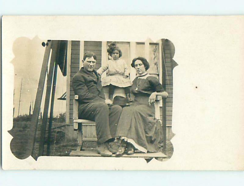 Pre-1920's rppc CUTE GIRL SITTING UP BETWEEN PARENTS r6293