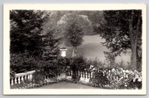 RPPC Beautiful Garden Wall Covered In Flowers Trees Lake George  Postcard B33