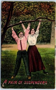 Postcard - A Pair Of Suspenders with Lovers Hanging A Tree Picture