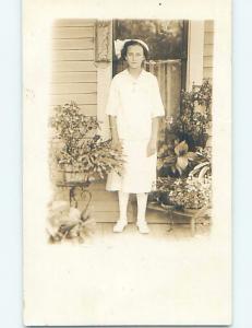 Pre-1918 rppc PRETTY GIRL STANDING BESIDE MANY POTTED PLANTS HM0228