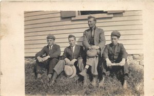 1910s RPPC Real Photo Postcard Group Of Young Men Hanging Out Outside Grass