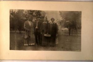 pre-1918 rppc WOMEN HOLDING A CASE & PURSES - made in Waterloo Iowa IA y3582