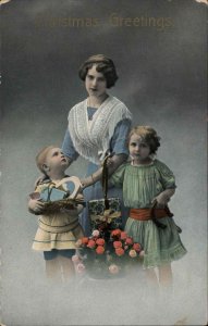 Christmas Pretty Woman Mom & Children Presents Gel c1900s-20s Postcard