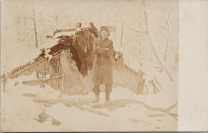 Portrait of Older Person in front Winter Hut Shack Michigan MI RPPC Postcard F17