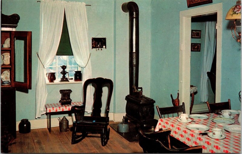 Interior View Old Amana Home Kitchen Restored Pot Bellied Stove Table Postcard 